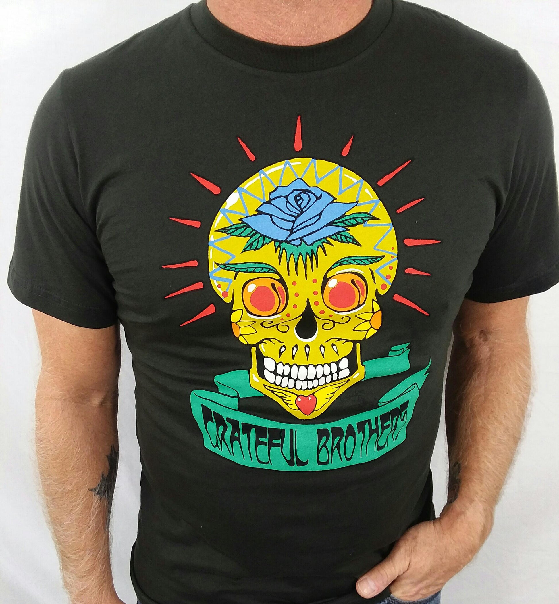 The Grateful Brothers black skull t-shirt on model organic band merch made in america blue rose music